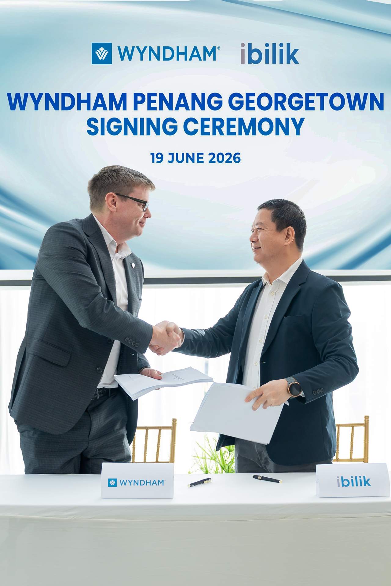 Wyndham Hotels & Resorts representative and iBilik Group representative signing franchise agreement for Penang George Town.
